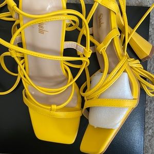 Beautiful yellow tie around the ankle sandals